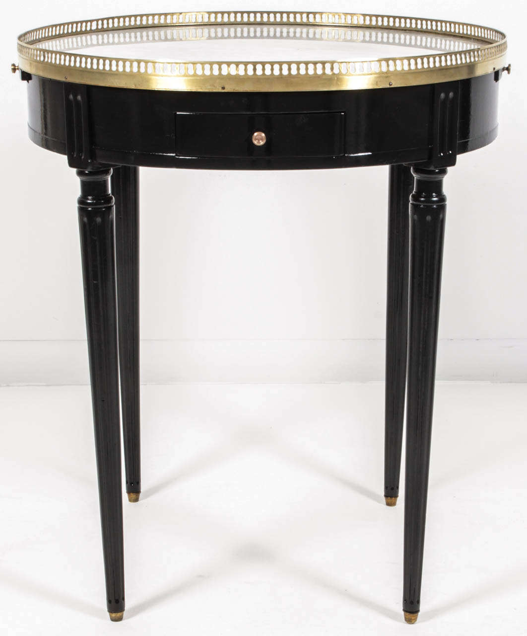 Round blank table with white marble top and brass gallery
Drawers on each side